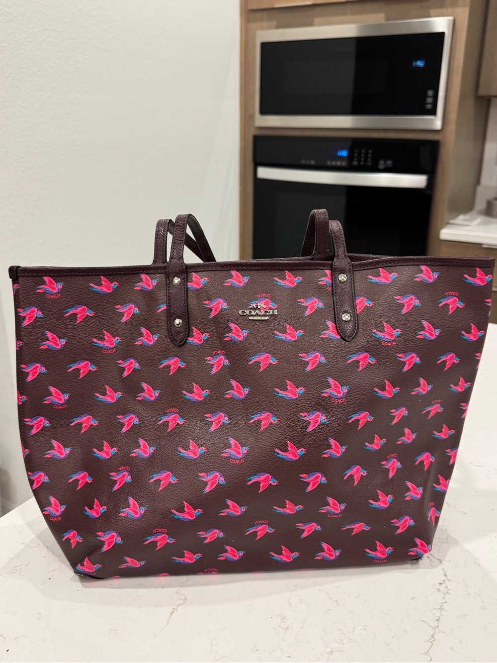 Coach City Reversible Burgundy Tote with Pink Bird Print